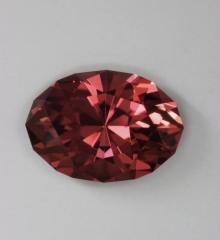 Medium toned very transparent orange pink oval