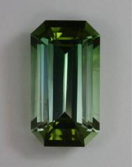 A spicy, tone graded, green emerald cut.