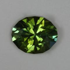 Above average slightly dichroic green oval.