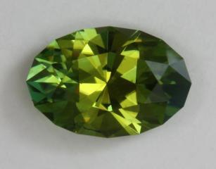 Nice, smaller, dichroic green with open ends, oval