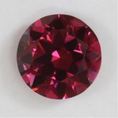 A darker toned red to pink droplet of color