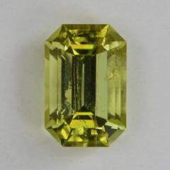 Slightly included saturated yellow emerald cut