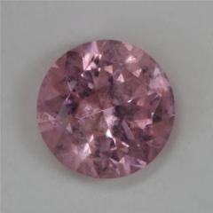 Pretty, little, medium light toned, slightly included, pink round.