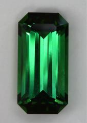 Great stable green emerald cut with dark ends.