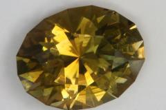 Dichroic yellow green with gold, touch of brown oval.