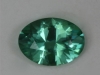 Dichroic green with bluer ends, oval