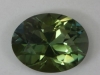 Very transparent dichroic green oval.