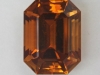 A great, medium dark, slightly burnt orange, emerald cut