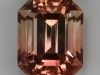 Bicolor pastel peach to clear emerald cut.