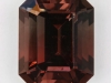 Interesting darker bicolor of pink and brown emerald cut.