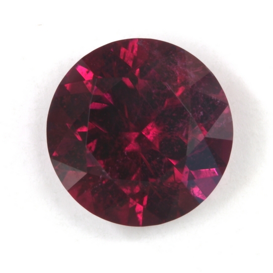 A very nice, medium dark, slightly included red round.  #18