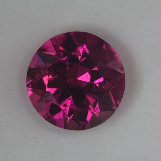 Hot pink slightly included round.  #27