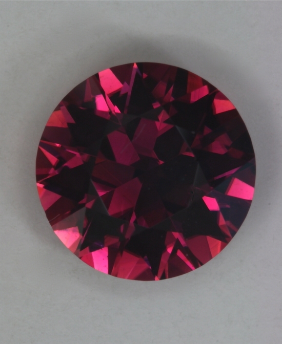 Darker pink with a purple cast, still a flashy round.  #45
