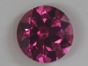 Two tiny inclusion for a medium light pink round.