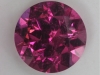 Moderately included, average pink round.  #26