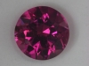 Hot pink slightly included round.  #27