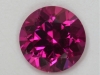 Medium toned hot pink to red round.  #35