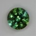 Dichroic green, deep round, cut parallel to the principle axis. #467