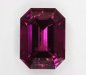 A red/purple, eye clean, emerald cut. #494