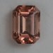 A smaller, dichroic, peach of an emerald cut. #507