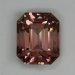 Mildly dichroic pastel pinkish peach, emerald cut.  537