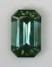 Highly transparent, non dichroic green wash in blue, emerald cut.  #540