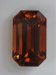 Large, clean, brigh,t rich orange, emerald cut.  #541