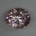 Included, bright, glissening, icy pink oval.  574