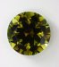 Large olive green round witih substance. #595