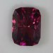 Radiating red rays with purplish overtones in a Barion cushion cut.  #600