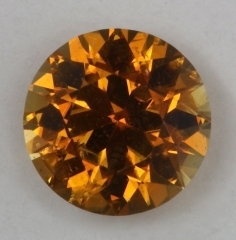 A yellowish orange droplet of color.  #635