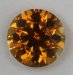 A yellowish orange droplet of color.  #635