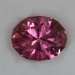 Nice medium pink with numerous tinny inclusions, oval.  #658