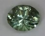 Clear, non dichroic, pastel celery green oval.  #660