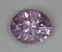 Moderately included, lilac colored, cuprian oval.  #661