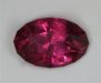 Slightly included orange to rich pink slider, oval  #667