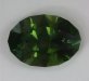 A fine darker green oval that roars to life with the light.  #668