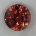 Complex colors of gold, orange and pink in a nice round. 687