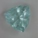 Heavily included medium pale blue shield cut.  #689