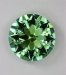 Larger yellow green round with dichroic blue green on the edges.  #695