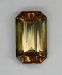 Mildly dichroic golden with a bit of green, emerald cut.  #713