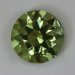 Slightly included yellow green round.  #719