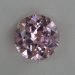 This baby pink round from Afghanistan is moderately included.  #745