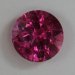 This moderately included, red/pink round.  #762
