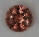 Lightly included, bright pastel orange, round.  #780