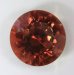This is a GEM with a great orange color that has a secret, round  #791