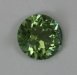 Small bright green round tha this slightly included.  #796