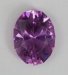 Moderately clean, cuprian, pink with a distinct purple cast, oval.  #814