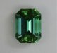 Bright, medium tone ,dichroic green emerald cut with one eye visible inclusion.   #817