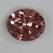 A medium pastel pink oval with a stepped crown.  #820